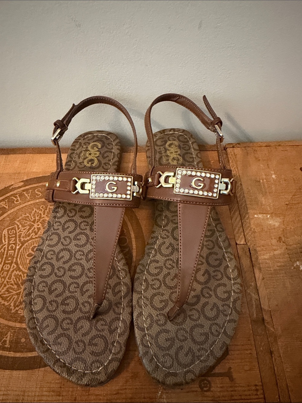 Guess Brown Logo T-Strap Sandals with Gold Plaque and Crystal Accents